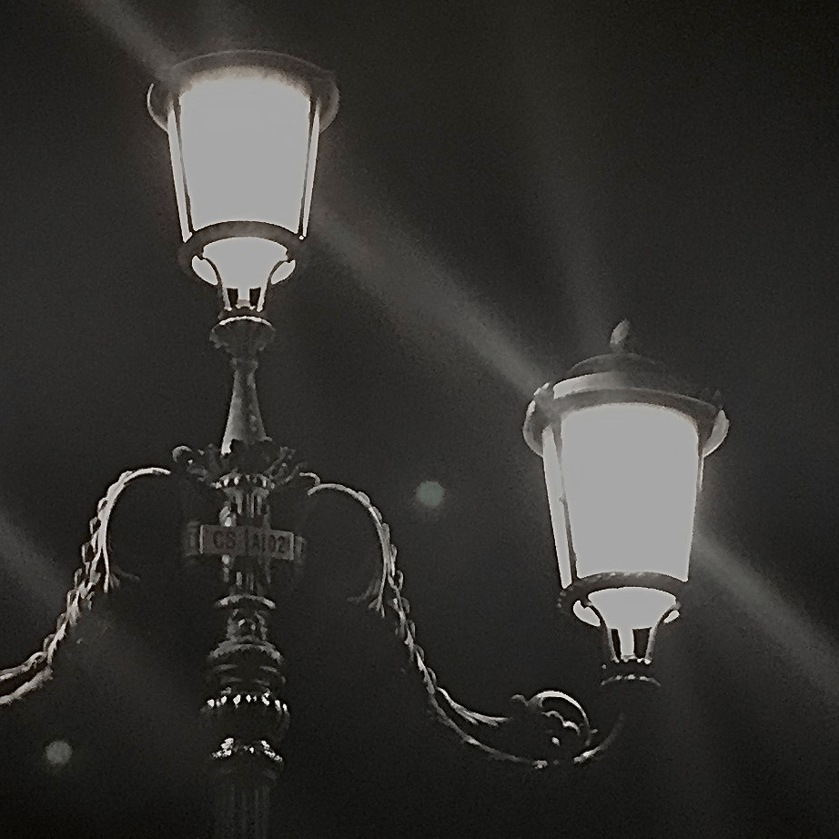 A photograph of a lamppost, edited to have high contrast.